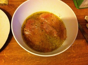 marinating chicken in olive oil with lemon juice and herbes de provence